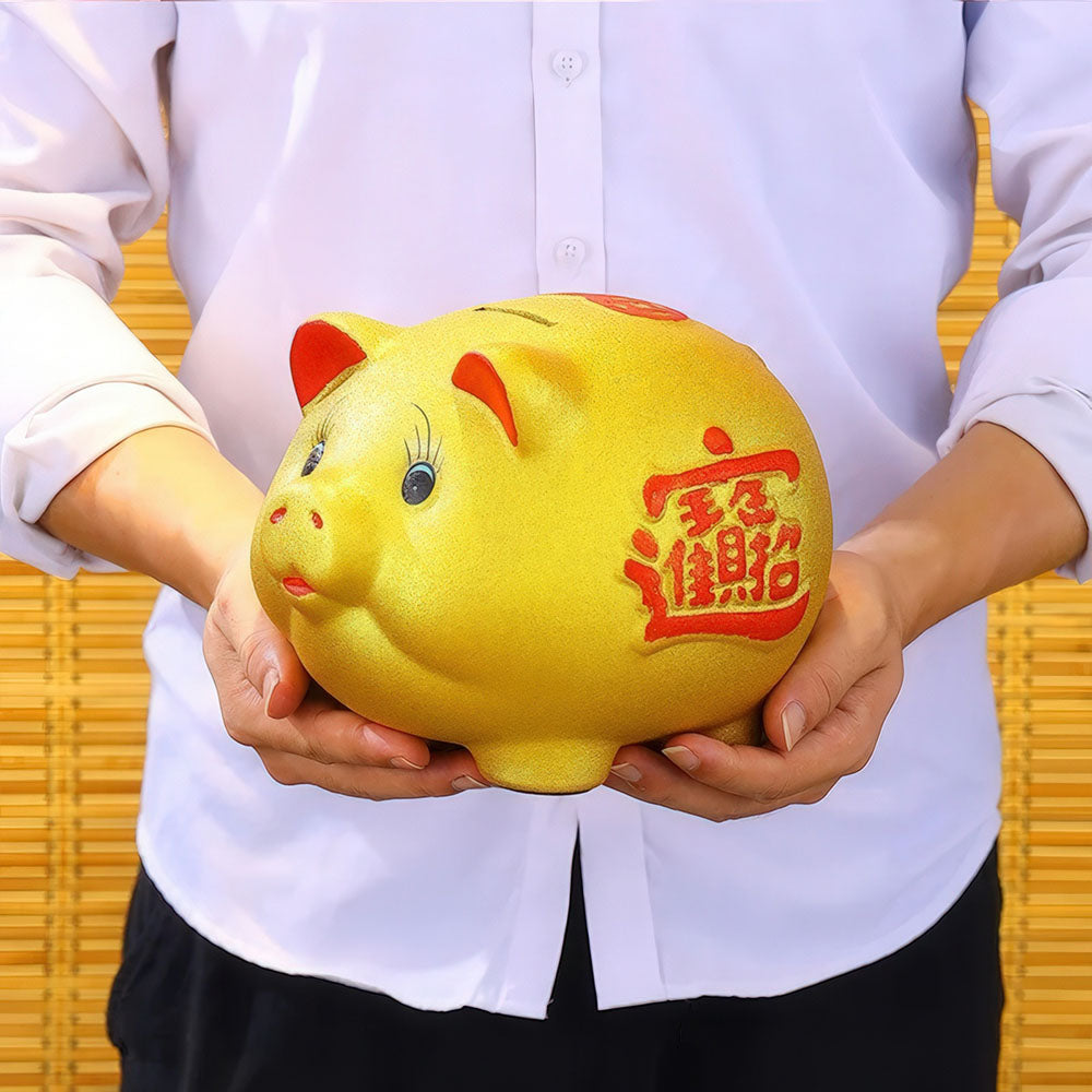 Tirelire en forme de cochon d'or pour attirer la prospérité et la richesse.