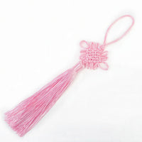 Thumbnail for Le nœud porte-bonheur chinois de couleur rose pâle.