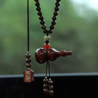 Thumbnail for Le porte-bonheur chinois en bois rouge, avec sa gourde Wu Lou sculptée.