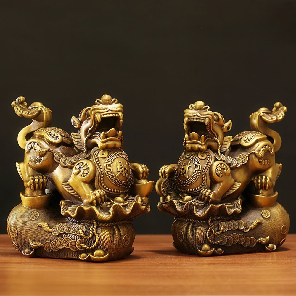 La paire de Lions Gardiens chinois en cuivre, symboles de la protection et de l'attraction de la fortune.