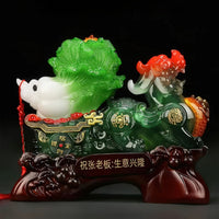 Thumbnail for La statue porte-bonheur chinoise  avec le chou de la fortune tiré par le Pixiu.