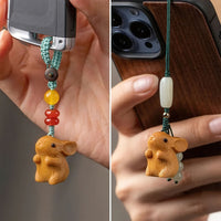 Thumbnail for Les porte-bonheurs lapin utilisés comme pendentifs de clé de voiture et de téléphone portable.