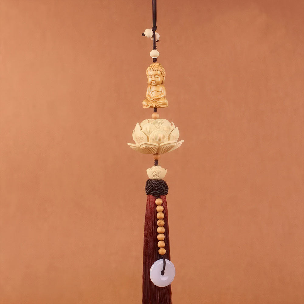 Le porte-bonheur chinois pour voiture, modèle Bouddha, avec son pompon marron.
