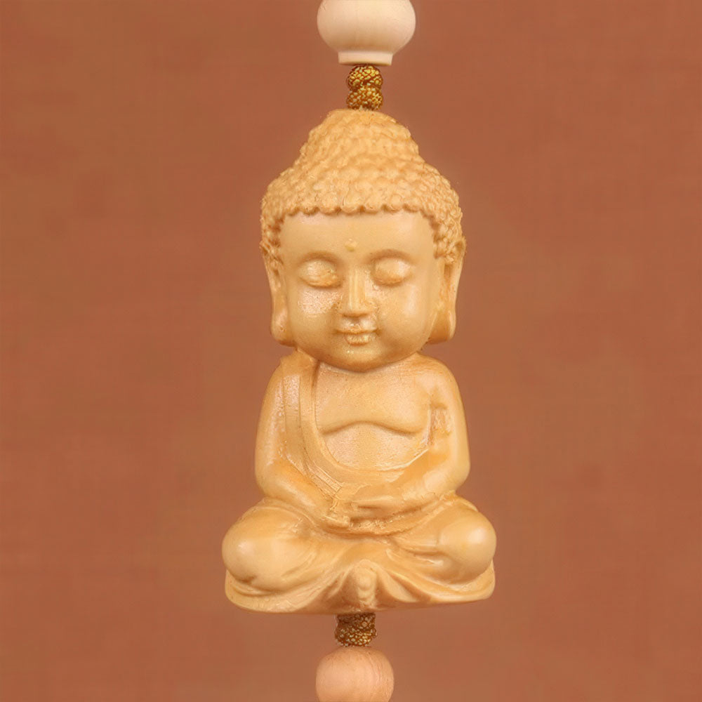 La sculpture en bois de Bouddha en méditation, pour un voyage serein.