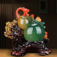 Thumbnail for La statue porte-bonheur en forme de gourde chinoise, modèle vert et orange, avec son arbre de fortune.