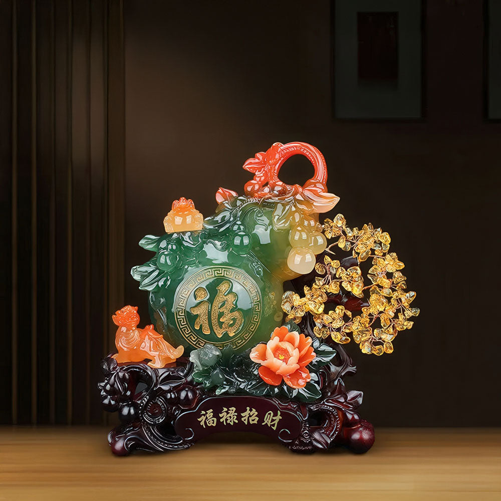 Le modèle vert et orange de la gourde porte-bonheur, avec son arbre de fortune et ses gardiens Pixiu.