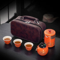 Thumbnail for Variante orange de notre service à thé en céramique, avec sa mallette.