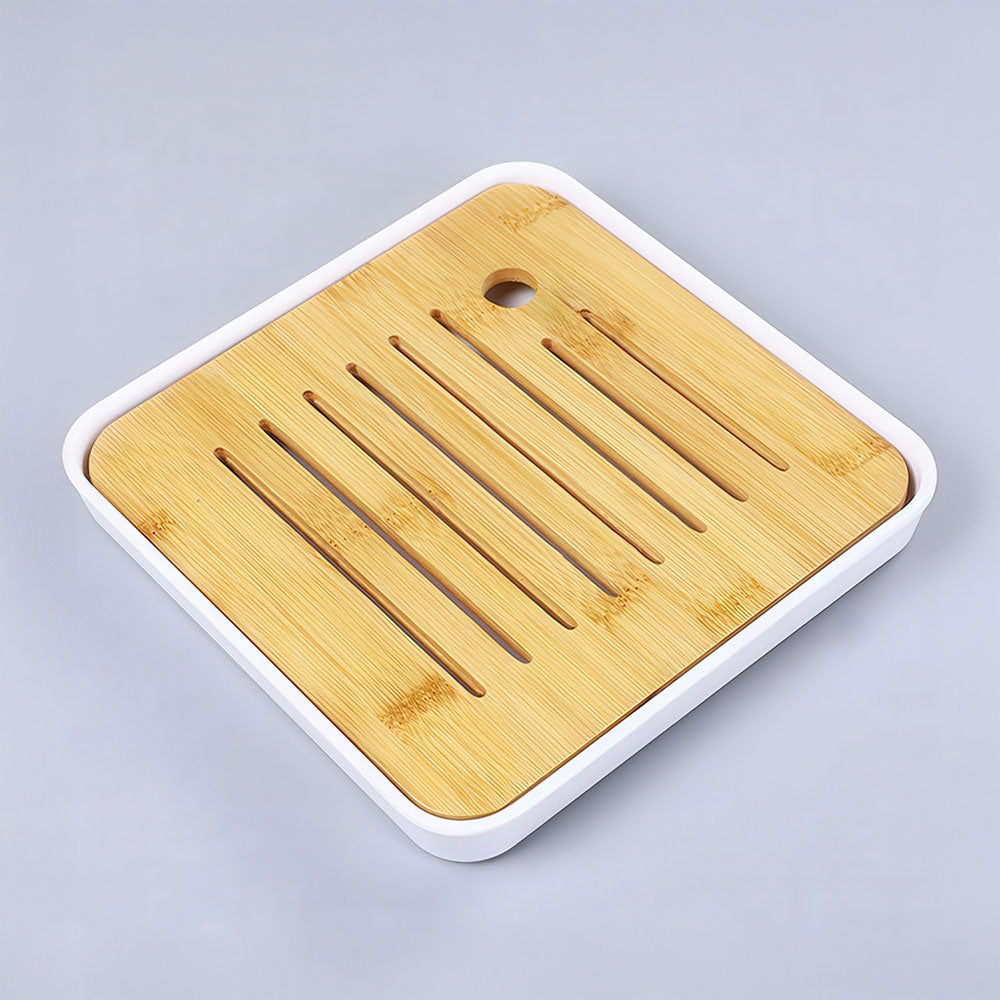 Le "chapan" ou plateau à thé drainant, essentiel pour le rituel du Gong Fu Cha